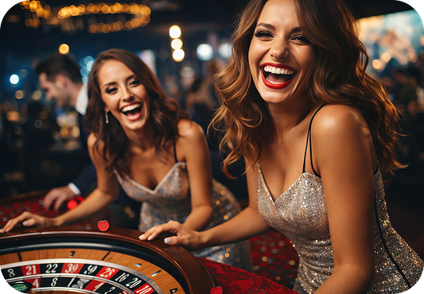 Women laughing at roulette table in glamorous casino setting